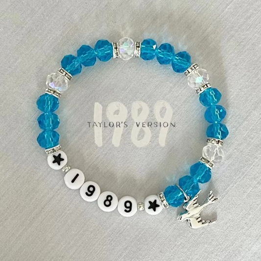 Beaded bracelet with blue beads and seagull charm