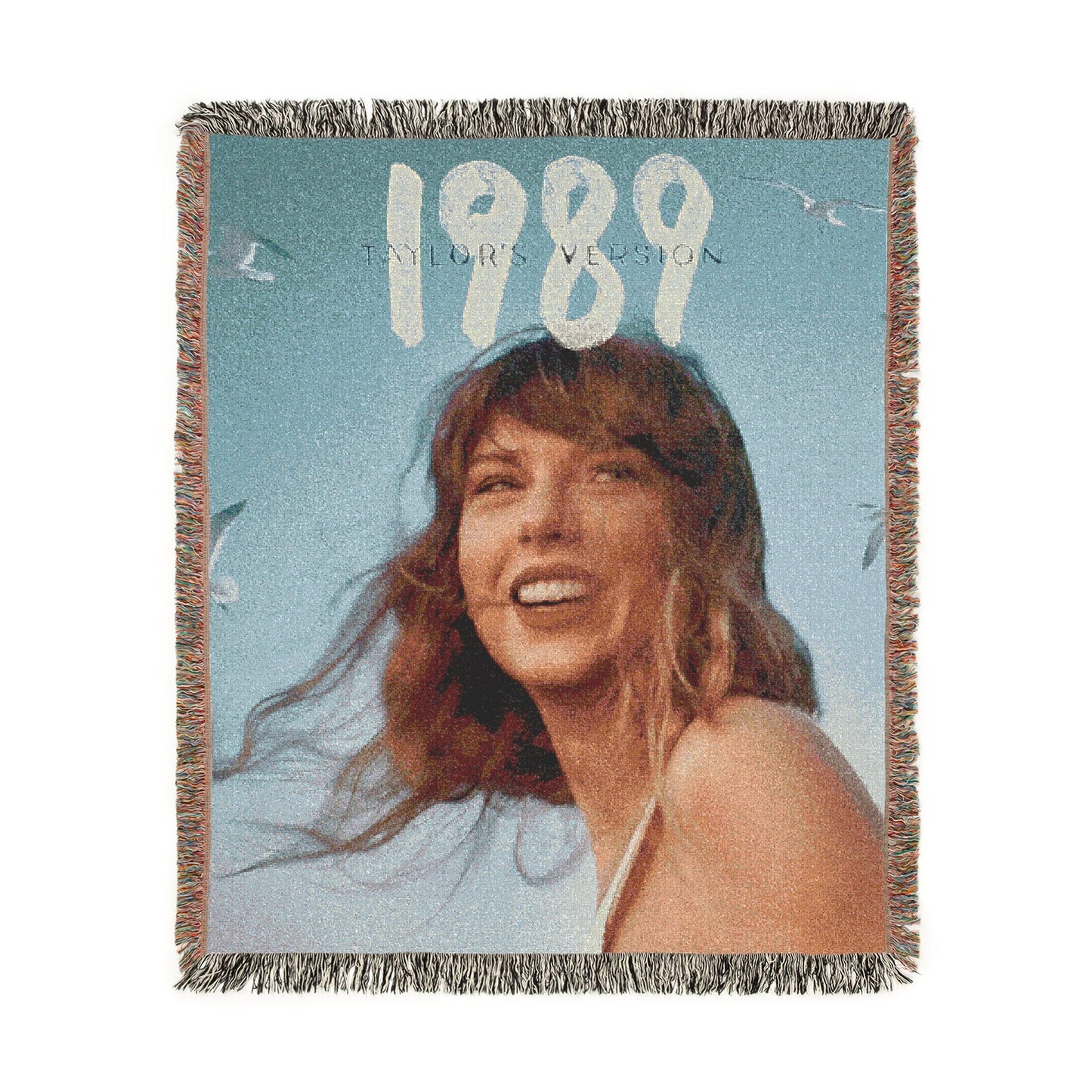 Woven blanket with a person and '1989' text on a blue background