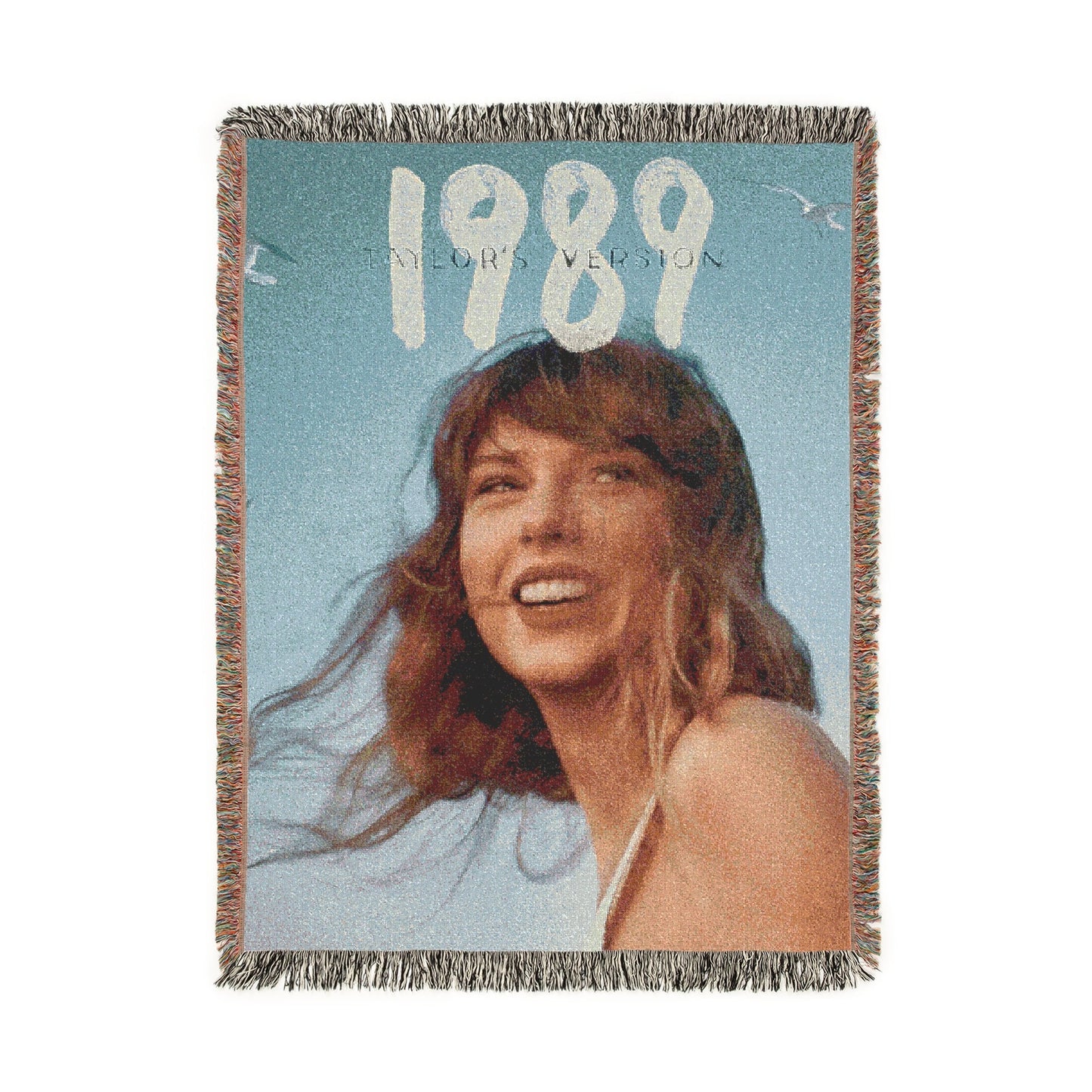 Woven blanket with a person and '1989' text on a blue background