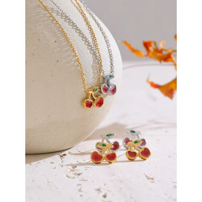 cherry necklace and earrings set with red enamel cherries and green leaf details