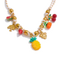 tropical fruit charm necklace with colorful enamel and glazed fruit pendants on a beaded chain.